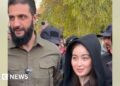Syria insurgent chief dismisses controversy over photograph with lady