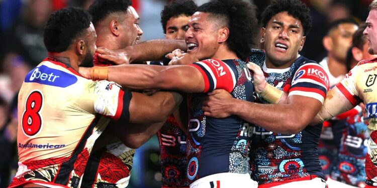 Roosters destroy Dolphins however Woolf howls over melee sin bins, Canine devour Warriors, Dragons shock Sharks